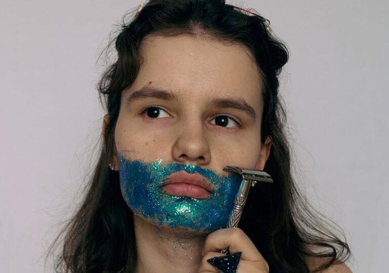 woman with blue and green paint on her face